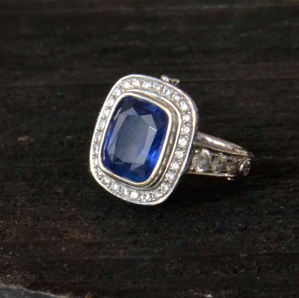 Blue sapphire set with diamonds in white gold